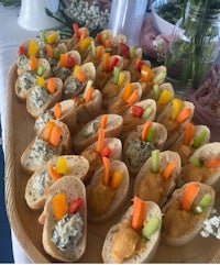 a tray of appetizers with dips on it