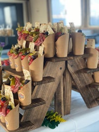 a set of wooden trays with snacks on them